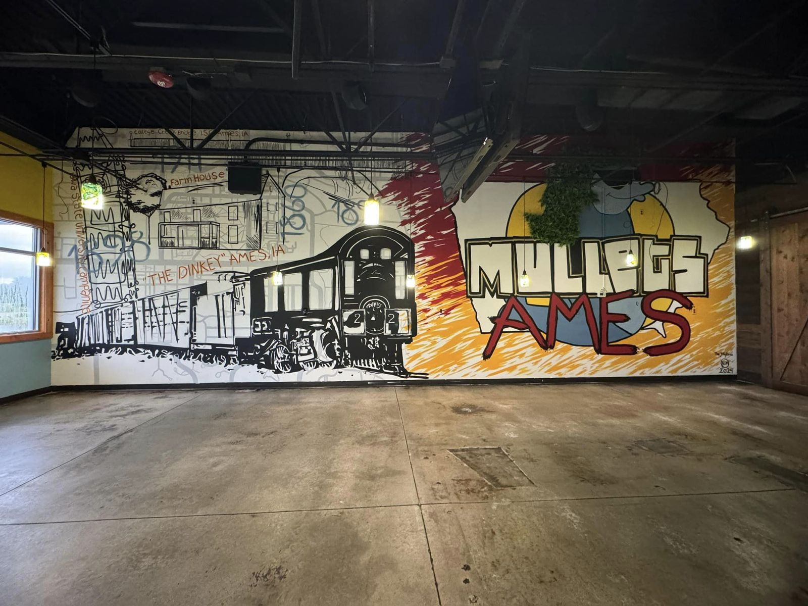 Full view of the Mullets Ames mural wall inside the restaurant